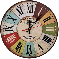 an old time clock with roman numerals on the face and numbers in different colors