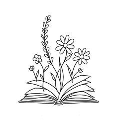 an open book with flowers on it