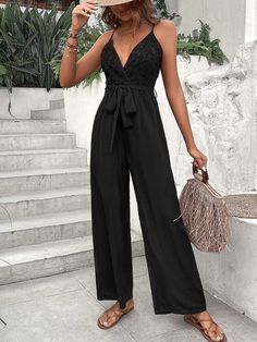 Make a bold statement with the Lace Belted Cami Jumpsuit. This elegant jumpsuit features the color black, plain pattern type, and details such as a belted wrap and contrast lace for extra style points. Show off your fashion sense in this versatile jumpsuit that will have heads turning when you enter any room! Get yours today and get ready to stun everyone! Features: Color: Black Style: Elegant Pattern Type: Plain Details: Belted, Wrap, Contrast Lace Length: Long Type: Cami Fit Type: Regular Fit Neckline: Spaghetti Strap Sleeve Length: Sleeveless Waist Line: High Waist Fabric: Non-Stretch Material: Fabric Composition: 100% Polyester Body: Lined Belt: Yes Sheer: No Size Chart (Inches): Product Measurements Size US Bust Hip Size Inseam Length Thigh Waist Size S 4 35.4 41.3 27.6 56.3 26.6 28.3 Belted Jumpsuits And Rompers For Night Out, Summer Evening Jumpsuits And Rompers With Tie Waist, Summer Evening Jumpsuits With Tie Waist, Black Belted Jumpsuit For Date Night, Chic Black Jumpsuit With Tie Waist, Chic Black Belted Jumpsuits And Rompers, Black Belted Jumpsuits And Rompers For Evening, Party Jumpsuits And Rompers With Tie Waist, Black Belted Jumpsuit For Party