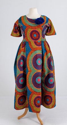 Stylish and sophisticated, this Formal Traditional. Made with 100%. Multicolor Cotton Dress With Smocked Bodice, Cotton Multicolor Dress With Smocked Back, Fitted Multicolor Midi Dress With Smocked Bodice, Elegant Multicolor Cotton Midi Dress, Fitted Multicolor Dress With Smocked Back, Flare Ankara Dress, Wedding Anniversary Photos, Anniversary Photoshoot, Ankara Dress