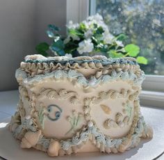 a decorated cake sitting on top of a white plate