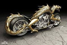 a gold colored motorcycle with a dragon on the front