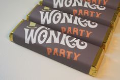 three chocolate bars with the words wonky wonka party printed on them are sitting next to each other