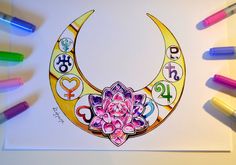 a drawing of a crescent moon with flowers and numbers on it, surrounded by crayons