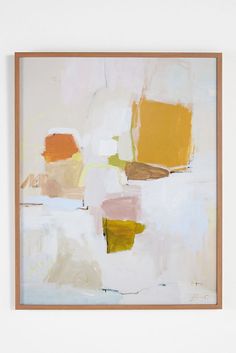 an abstract painting with white, yellow and brown colors on it's surface in black frame