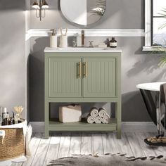 a bathroom with a sink, mirror and bathtub in the middle of the room