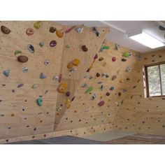 an indoor climbing wall with several different types of rocks