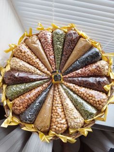 a person holding a tray filled with different types of beans and other foods in it