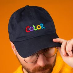 "Flashback to the 2nd grade with this beautifully embroidered Nintendo Gameboy Color inspired design. * 100% chino cotton twill * Unstructured, 6-panel, low-profile * 3 ⅛\" crown * Adjustable strap with antique buckle * Head circumference: 20 ½\" - 21 ⅝\"" Casual Cotton Baseball Cap With Custom Embroidery, Cotton Dad Hat With Letter Embroidery And Flat Bill, Multicolor Cotton Hat For Streetwear, Multicolor Snapback Baseball Cap In Cotton, Cotton Dad Hat With Embroidered Patch, Custom Embroidered Cotton Baseball Cap With Curved Brim, Embroidered Cotton Hat For Streetwear, Custom Embroidered Cotton Snapback Baseball Cap, Multicolor Cotton Snapback Baseball Cap