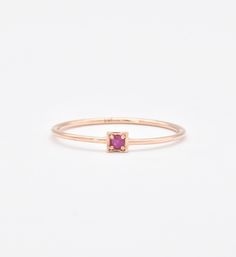 This CERTIFIED Ruby Ring features Genuine Ruby at 2mm (0.03 Carats) set in Solid 14k Rose Gold Ring setting. Designed to stand-alone or stack with the rest of our Stackable Ring collection, this ring would make the perfect July Birthday gift.Solid 14k Yellow Gold ☞ made to last.Click here for ☞ Solid Gold Collection﻿Ruby Details:• CERTIFIED Natural Ruby• Weight: 0.03 Carats• Dimensions: 2mm• Cut: Diamond CutSetting Details:• 2.2 grams of 14k Solid Rose Gold• Dimensions: Band width ≈ 1.3mm, thick 14k Rose Gold Stackable Rings With Single Diamond, Rose Gold 14k Gold Stackable Rings With Single Diamond, Stackable 14k Rose Gold Rings, Stackable Ruby Ring In 14k Rose Gold, 14k Rose Gold Ruby Promise Ring, Rose Gold 14k Birthstone Ring With Round Band, Minimalist Rose Gold Ruby Ring For Anniversary, 14k Rose Gold Birthstone Ring, Dainty Ruby Ring