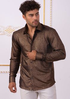 Limited edition- One of a kind A modern shirt with an unexpected edge. This brown metallic brocade shirt from Mondo is embellished with shine texture fabric detailed. Looking sharp Your style status can’t be messed with, and this shirt from Mondo makes that clear. A new and versatile wardrobe staple, great for under the blazer for dinner, party and special occasion night A tailored, modern cut and cotton fabric makes for a flattering shirt. Paired with a coordinating pant you'll have an elevated Custom Buttons, Wardrobe Staples, Men Sweater, Nice Dresses, Long Sleeve Shirts, Cotton Fabric, Mens Shirts, Blazer, Wardrobe