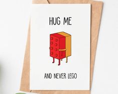 a card with an image of a lego on it and the words hug me and never lego