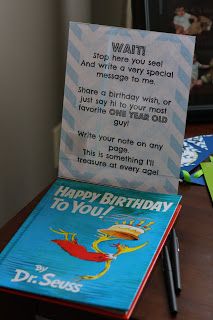 a dr seuss birthday card sitting on top of a desk next to a book