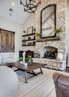 a living room filled with furniture and a fire place