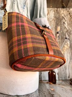 This seamless and intricate tartan plaid is woven into the fabric and is just perfect for those crisp walks in the autumn air.

The Atenti Scottie Halle Bucket Bag features two interior pockets, leather detachable adjustable crossbody strap, and a leather closure. Halle measures: 8″ wide x 8″ high x 5.5″ deep. Fall Leather Trim Crossbody Shoulder Bag, Fall Bags With Brass Hardware, Fall Shoulder Bag With Leather Trim, Crossbody Shape, Everyday Bags With Brass Hardware For Fall, Fall Shoulder Bag For Everyday Use, Fall Leather Trim Satchel Shoulder Bag, Fall Brown Shoulder Bag With Snap Closure, Fall Satchel Shoulder Bag With Leather Trim, Fall Travel Shoulder Bag With Leather Trim