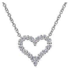 Tiffany & Co. Platinum and Diamond Heart Pendant Necklace The perfect little heart necklace for layering or worn by itself. .25 Carats of fine quality round brilliant cut diamonds set in platinum. Chain length: 16' Heart Dimensions: 11mm H x 11.60mm W Diamond Pendant Necklace Tiffany & Co., Diamond Necklace Pendant Tiffany & Co., Luxury Classic Heart Solitaire Necklace, Luxury Heart Cut Brilliant Solitaire Necklace, Diamond Heart Necklace Tiffany & Co., Tiffany&co Necklace, Diamond Pendant Tiffany & Co., Heart-shaped Cubic Zirconia Necklace With Prong Setting, Heart Pendant Diamond Necklace With Brilliant Cut Cubic Zirconia