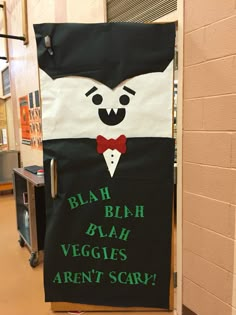 a door with a sign that says, blah blah veggies aren't scary