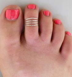 SIZING METHOD for Toe or Midi Rings: 1) For Toe Rings, use half of your shoe size, or your full pinkie size (80% accurate) 2) Measure your Toe/Finger using a string or Dental Floss * With a piece of string or dental floss, wrap it snugly but not tight at the part of the toe/midi where you want the ring will lay (on the toes, typically between the knuckles) and mark it where the ends meet. * Lay your measured string on the mm side of a ruler and get a mm measurement. * Look up your size on the ch Adjustable Gold Toe Rings, Minimalist 14k Gold-filled Midi Toe Rings, Pink Adjustable Toe Ring, Gold 14k Gold-filled Toe Ring Jewelry, Minimalist 14k Gold-filled Stackable Toe Rings, Gold Thumb Rings, Gold Toe Rings, Ear Pins, Knuckle Ring