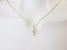 "Small pearl cross necklace, Dainty cross necklace, Cute cross necklace, Gold Silver Rose gold necklace, pearl cross necklace, pearl jewelry Item details ♪ Color: gold / silver / rosegold ♪ Pendant size:  8mm x 12mm ♪ 16K shiny gold/whitegold/rosegold over brass   ♪ Acrylic super tiny white pearls ♪ Necklace length: 15-19\" ♪ Packed individually in a gift box Handmade with Love by Clara ---------------------------------------------- ► Enter shop here : https://www.etsy.com/shop/jeweltown All Pho Pearl Chain Cross Pendant Necklace Gift, Gift Pearl Chain Cross Pendant Necklace, Gold Cross Necklace With Pearl Chain, Pearl Chain Cross Necklace As Gift, Pearl Chain Cross Necklace Gift, Gold Cross Necklace With Pearl Pendant, Gift Pearl Pendant Cross Necklace, Pearl Drop Cross Pendant Necklace, Cross Necklace With Pearl Charm