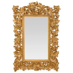 an ornate gold framed mirror against a white background