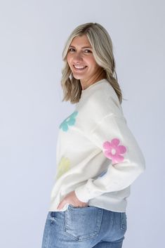 Are you ready to brighten everyone's day with our Flower Power Daisy Print Sweater!? This white knit sweater has the most adorable pastel daisy print that is perfect to help you transition from Winter to Spring. This sweater is perfectly light weight and detailed with a ribbed contrast hem around the round neckline and arm cuffs. Pair it with jeans on a chilly day, or with shorts for the perfect Spring look! - White knit sweater with pastel daisy print - Light weight knit sweater - Ribbed contra Winter To Spring, Arm Cuffs, White Knit Sweater, Spring Look, Favorite Daughter, Arm Cuff, Print Sweater, Daisy Print, Spring Looks