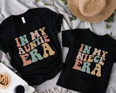 Step into a world of shared experiences with our "In My Aunt Era" and "In My Niece Era" shirts, a perfect tribute to the timeless bond between aunt and niece. Embrace the joy of connection with our Auntie and Me matching shirts, a thoughtful gift that captures the essence of a cherished relationship! PLEASE NOTE: Colors may seem different on the computer screen, or in the lighting in which the picture was taken. The way that we print our shirts is Direct-to-Garment printing, meaning that the des Aunt And Niece Shirts, Mens Cuts, Aunt Gifts, Adulting Shirts, Baby Shirts, Matching Shirts, Favorite Shirts, Custom Shirts, Colorful Shirts