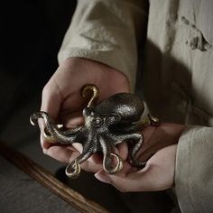 a person holding an octopus in their hands