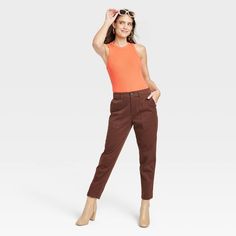 Update your separates closet with the Ribbed Crewneck Tank Bodysuit from A New Day™. This sleeveless bodysuit is designed with an allover ribbed pattern in an elegant solid hue for a chic and sophisticated look, and it has reinforced ribbed trim around the neck and armholes for additional flair. The pull-on tank bodysuit is made from a soft and stretchy fabric to give you a comfortable fit that moves with you, and it boasts a full-coverage bottom along with metal snaps at the crotch for added co Spring Sleeveless Ribbed Bodysuit, Ribbed Bodysuit For Workwear, Sleeveless Stretch Bodysuit For Fall, Stretch Sleeveless Bodysuit For Fall, Sleeveless Brown Bodysuit For Spring, Chic Sleeveless Bodysuit For Fall, Trendy Sleeveless Bodysuit For Fall, Casual Sleeveless Bodysuit For Work, Katy B