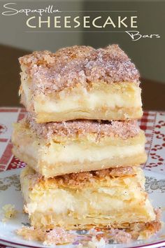 three pieces of cake sitting on top of a red and white plate with the words, simple cheesecake bars