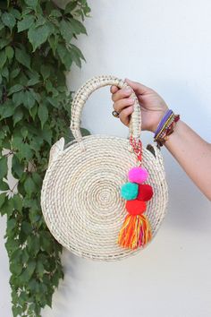 Lightweight Bag. Large Bag. Hand died palm leaf. Round Handel. Beach Bag. TASSEL SOLD SEPARATELY Diameter- 10 inches Height including handals- 15 inches Bohemian Natural Beach Bag For Spring, Bohemian Beach Bag For Festivals, Bohemian Natural Woven Beach Bag, Bohemian Beach Bag With Tassels, Handmade Multicolor Beach Bag For Festivals, Beige Bohemian Beach Bag With Tassels, Bohemian Beige Beach Bag With Tassels, Bohemian Handmade Beach Bag For Vacation, Bohemian Beach Bag For Summer