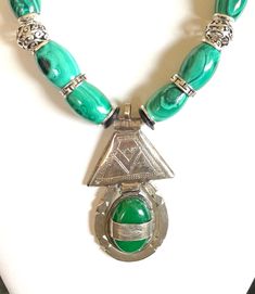 "Bold, dramatic, elegant, statement necklace \"Irakere\" means 'forest' in the African language of Yoruba Gorgeous rich green and black malachite beads from the Congo Taureg silver and green agate pendant (2\"hx1\"w) Silver slice spacers and hook clasp #348 - \"Irakere\" Length OA 21\"" Traditional Green Malachite Jewelry, Silver Malachite Necklace With Natural Stones, Elegant Statement Necklace, Lux Jewelry, Exotic Jewelry, Luxe Jewelry, Green Malachite, Green Agate, Hook Clasp