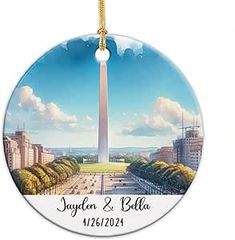 a round ornament with the washington monument in the background and name on it