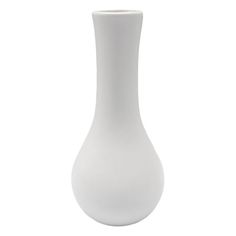 a white vase sitting on top of a table