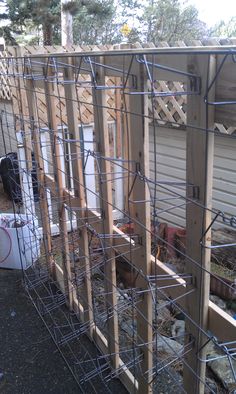 a chicken coop is being constructed in the yard