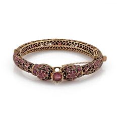 "This is a gorgeous vintage bangle bracelet, it is crafted from 9k rose gold featuring a double snake head joined at the front with a large round ruby mounted in a floral pot above the snakes head. The 9mm wide filigree tube bangle has fany open floral design set with a total of 6 carats rubies! It is hinged and secures with a push in clasp, chain is attached for added security. Material: 9k rose gold Ruby: 6.00 total carat weight Measurements: inner circumference: 6.75\" x 0.36\" wide x 0.32\" Snake Bangle, Ruby Bangles, Vintage Bangle Bracelets, Snake Head, Fancy Jewellery Designs, Antique Jewelry Indian, Vintage Bangles, Gold Rings Fashion, Indian Jewelry Sets