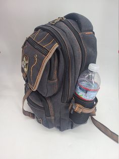 Cotton Canvas Backpack, Hiking/Travel Backpack, Small Backpack, School Backpack, Unisex Backpack This backpack is made of a high quality cotton canvas. It has 2 large volume main compartment, 4 front zippered pockets, plus two side pockets with elastic for water bottle and other stuff. Comes with adjustable padded straps for your comfort. This backpack is small but will easily fit your mini laptop, iPad, books, and other daily necessities.Perfect smaller sized unisex Backpack for School, Work an Outdoor Canvas Backpack With Adjustable Strap, Canvas Backpack For Outdoor Activities With Pockets, School Bag With Cell Phone Pocket In Cotton, Canvas Softback Backpack For Outdoor, School Bags With Cell Phone Pocket In Cotton, School Bags With Cell Phone Pocket, Outdoor Canvas Softback Backpack, Cotton Backpack For Outdoor Activities, Functional Cotton Backpack For Outdoor Activities