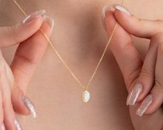 "This dainty white opal necklace ( Real Opal Necklace, Oval White Opal Pendant) is perfect birthday gift a girl or a woman. Also, this real white opal necklace would be a great mother, new mom, daughter, bridesmaid, bride, bridal shower, baby shower, anniversary, grandma, teenage girl, graduation, girlfriend, best friend, engagement, baptism, wedding gift or a treat for you! This minimalist jewellery has been produced with high quality 925k solid silver and available in silver, gold and rose gold colour. You can choose chain length/colour and you can make your unique jewellery. * great for daily wear * hypoallergenic * nickel-free, lead-free & cadmium-free * chain in different lengths * handmade in the UK * arrives in gift box * can include your gift message (leave in Note to Seller at che Dainty Oval Necklace Ideal For Gifts, Dainty Oval Necklace For Gift, White Oval Necklace With Delicate Chain, White Opal Anniversary Necklace, Opal Necklaces As A Gift, White Oval Pendant Necklace With Birthstone, White Gold Opal Necklace With Oval Shape, Handmade Oval Opal Necklace, Opal Oval Pendant Jewelry For Gift