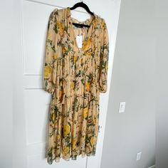 Sheer Dress With Matching Slip. Horizontal Ruffles. Deep V Neck With Tie. Flowy Skirt, Length Between Midi And Maxi. Creamy, Yellow/Tan Color With Yellow/Gold/Mustard And White Flowers And Green Leaves. Reminds Me Of Sunflowers Yellow Floral Print Maxi Dress For Fall, Fall Floral Print Yellow Maxi Dress, Yellow V-neck Midi Dress For Daywear, Yellow Long Sleeve Midi Dress For Brunch, Yellow Midi Dress For Fall Brunch, Yellow Long Sleeve Midi Dress With Floral Print, Mustard Floral Print Maxi Dress For Spring, Yellow Floral Print Midi Dress For Fall, Mustard Spring Maxi Dress For Brunch