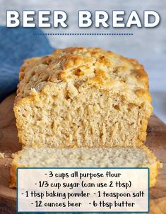 a loaf of beer bread sitting on top of a wooden cutting board