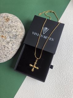 🌟 Elevate your style with our luxurious cross pendant necklace. Crafted with 18k gold plating, our necklace features a titanium steel cross pendant on a sleek stainless steel chain. Perfect for any occasion, this elegant piece is a must-have for every stylish woman. * Stainless Steel, titanium steel, stone * 18k gold plate * 19 3/4" (50cm) length, 2"(5cm) extender * 1 3/8" x 1 1/4 (3.6cm x 3cm) pendant * Lobster clasp closure 🌟 Helpful info: Protect your precious jewelry by keeping it away fro Gold Plated Pendant Cross Necklace, Gold Plated Cross Pendant Necklace, Gold Pendant Cross Necklace With Clavicle Chain, Luxury Tarnish-resistant Cross Necklaces, Gold-plated Cross Necklace With Adjustable Chain, Gold Plated Cross Necklace With Adjustable Chain, Luxury Clavicle Chain Necklace With Cross Pendant, Luxury Gold Plated Cross Pendant Necklaces, Luxury Gold Plated Cross Necklace