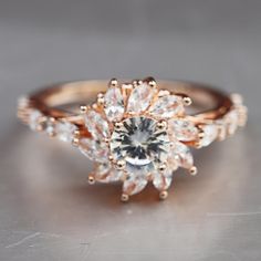 a close up of a diamond ring on a table