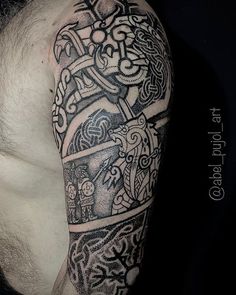 a man with a tattoo on his arm