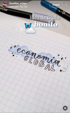 an open notebook with the words economic and global written in cursive writing on it