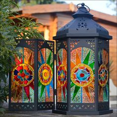 two colorful lanterns sitting next to each other