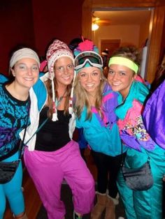 four women in ski gear posing for the camera