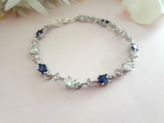 a bracelet with blue and white stones on it