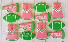 decorated cookies are arranged in the shape of footballs