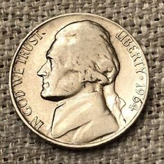 an image of a coin with the face of george washington on it's side