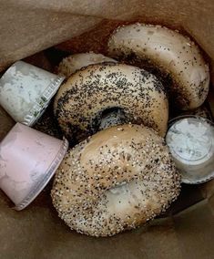 bagels and dips in a brown paper bag