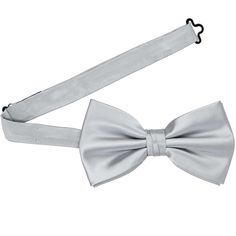 Our premium light silver bow ties are pre-tied with a band collar style that expands to fit most adult neck sizes. Its heavyweight woven material and smooth satin finish provide a sharp look that is suited for your most formal occasions. When compared to our standard bow ties, this bow is slightly larger. We recommend this shade for a light silver-gray. See it in person by requesting a free color swatch. Product Features Pre-tied band collar bow tie Men's size Bow measures approximately 5" acros Silver Bow Tie, Tie Men's, Bow Tie Collar, Shop Light, Streetwear Men, Silver Bow, Mens Bow Ties, Streetwear Men Outfits, Color Swatch